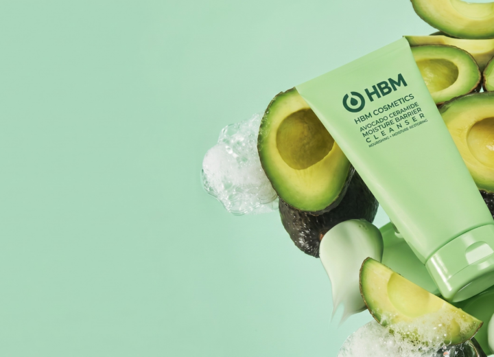 Ceramide-based cream in an editorial skincare shoot resting on fresh avocados, illustrating why ceramide-based creams are leading the future of barrier repair skincare and supporting skin hydration and barrier health